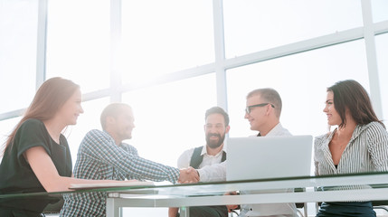 handshake business people over the Desk in the office