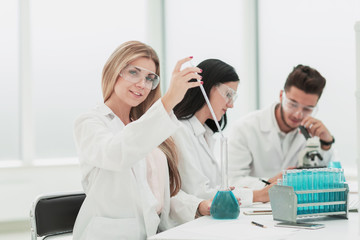 Fototapeta premium close up.a team of scientists conduct fluid research