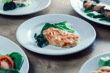 chicken fillet in cheese, and lettuce on the dining table