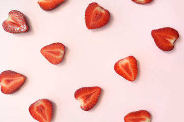 Strawberry slice red background texture. Top view. Concept of summer eco food