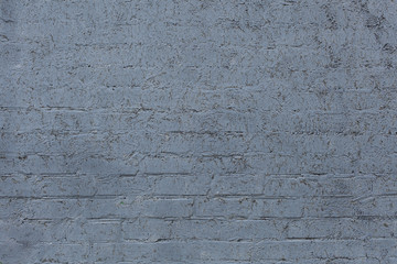 The brick wall painted a grey, textural background