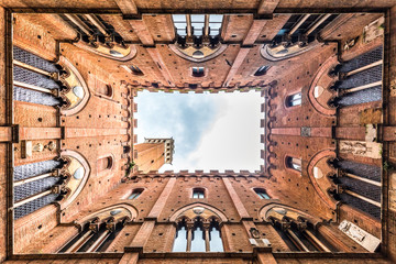 The Torre del Mangia, tower in the Piazza del Campo in Siena town in the Tuscany region of Italy, Europe.