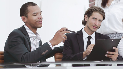 closeup. international business team discussing business issues.