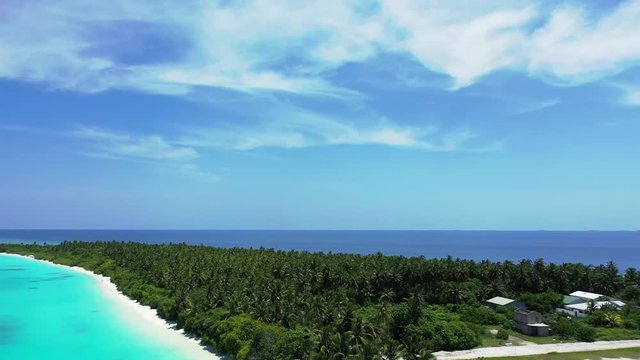 majestic aerial view of tropical island with preserved nature, idyllic holiday destination, drone panning left shot