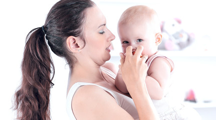 mother playing with baby from a comfortable apartment