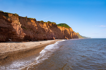 Red sandstone cliffs on the jurassic coast near Sidmouth, Devon, UK