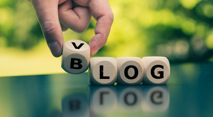 Blog or Vlog? Hand turns a cube and changes the expression 