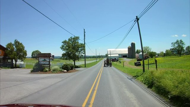 Driving Along Amish Countryside Came Across an Amish Man and Vintage Farm Tractor