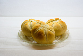 plate with buns of white bread with faded background
