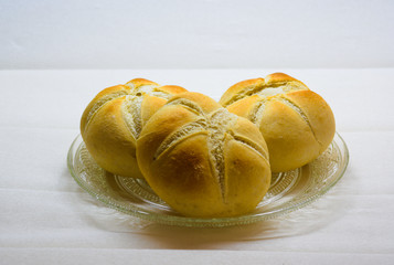 plate with buns of white bread with faded background