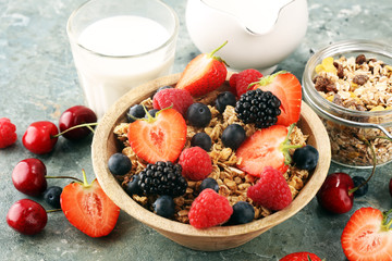 Cereal. Bowl of granola cereals, fruits and milk for breakfast. Muesli with cereals.