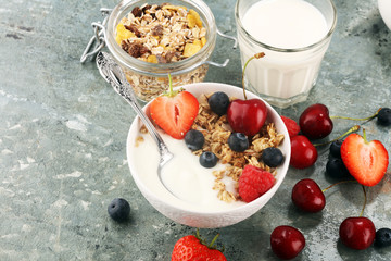 Cereal. Bowl of granola cereals, fruits and milk for breakfast. Muesli with cereals.