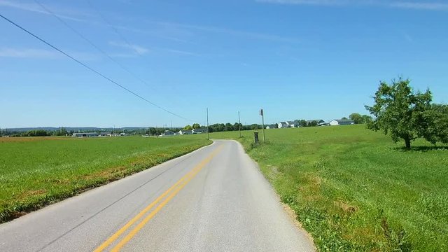 Driving Along Amish Countryside Came Across Amish Children in a Pony Pulled Wagon