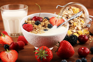 Cereal. Bowl of granola cereals, fruits and milk for breakfast. Muesli with cereals.