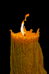 flame on the big candle on black background with clipping path.