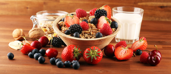 Cereal. Bowl of granola cereals, fruits and milk for breakfast. Muesli with cereals.