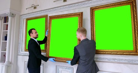 Exhibition department staff taking painting for restoration