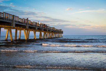 Sunset over Atlantic ocean with pier