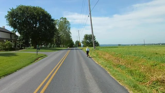 Driving Along Amish Countryside Came Across an Amish Boy on a Scooter