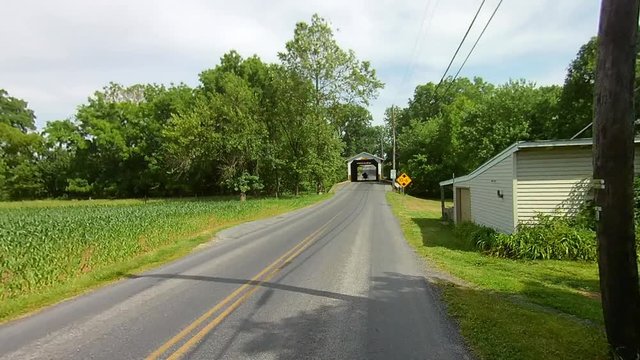 Driving Along Amish Countryside Came Across a Vintage Covered Bridge With an Open Horse and Buggy going Through It