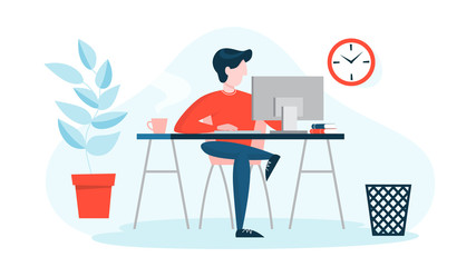 Man in a suit sitting at the desk and working