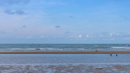Blue sky beach sea and sand.
