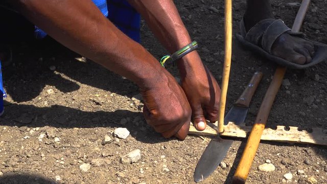 Masai traditional way of making fire. Arusha, Tanzania.