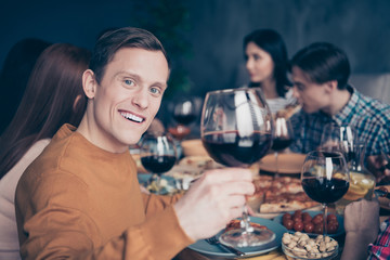 Close up photo company social crowd event hang out members best buddies different race ladies guys raise glass beverage call celebrate groupmate shirts formal-wear sweaters pullovers loft room indoors