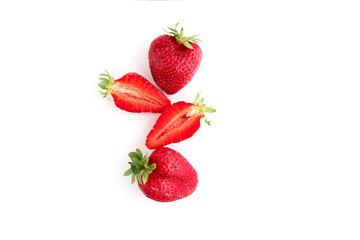Red strawberries cutted close up on white background. Isolated on white.