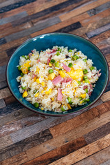 Homemade Chinese fried rice with vegetables and fried eggs