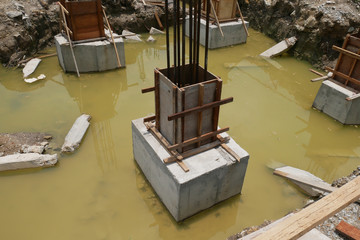Pile cap and column stump under construction at the construction site. Constructed using reinforced concrete with plywood timber as a form work.