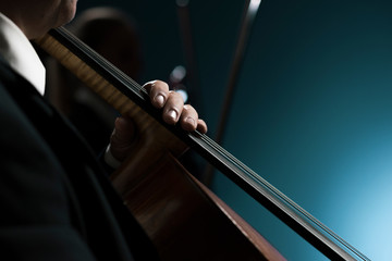 Professional cellist performing hands close up