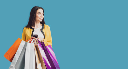 Fototapeta na wymiar Happy woman using shopping apps