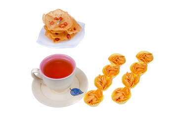 Tea cup , rempeyek and honey corn flake cookies  on white background