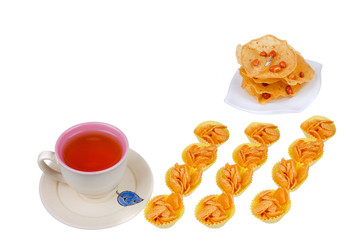 Tea cup , rempeyek and honey corn flake cookies  on white background