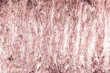 Abstract crumpled foil background. Grunge photo background. Pale pink color