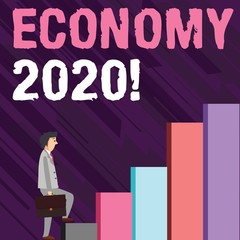 Obraz premium Writing note showing Economy 2020. Business concept for state of country in terms of production and consumption goods Man Carrying a Briefcase in Pensive Expression Climbing Up