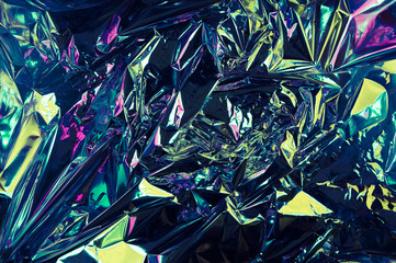Abstract crumpled foil background. Grunge photo background. Neon colors. Chameleon color