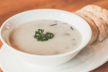 Cream of mushroom soup and garlic bread on the side
