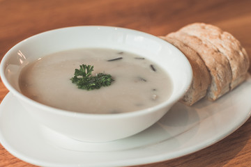 Cream of mushroom soup and garlic bread on the side