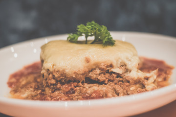 Chicken Lasagne Layers of thick pasta smothered with minced chicken, tomato sauce and cream