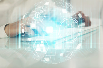 Obraz na płótnie Canvas Social network theme hologram with businessman working on computer on background. Multi exposure.