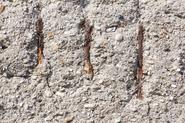 rust stains on concrete surface . Texture of old gray concrete wall for background.Reinforced concrete with damaged and rusty metallic reinforcement