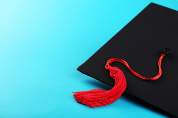 Graduation cap on blue background