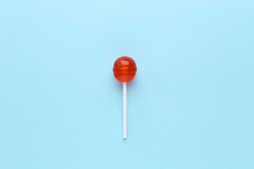 Sweet lollipop on blue background
