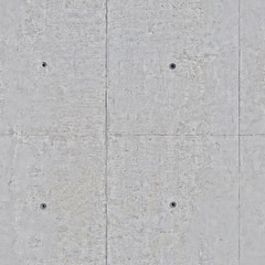 Concrete wall of gray color with small holes .Background or texture