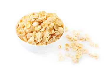 Corn flakes in bowl on white background