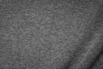 Fototapeta na wymiar Grey cotton texture background. Detail of sweater fabric surface.