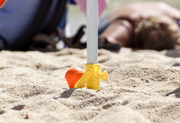 Support for beach umbrella. beach umbrella screw