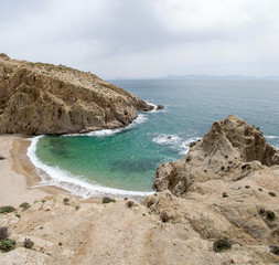 Fototapeta na wymiar Small rocky bay with fine sand on the island of Samothraki in Greece
